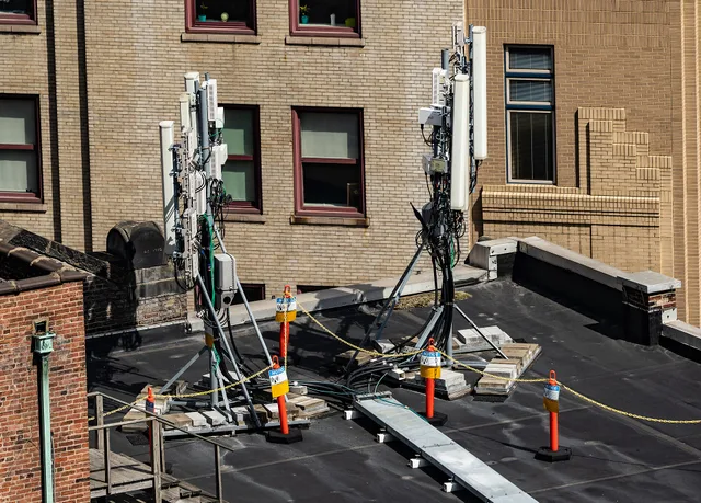 5G cellular antennas on a rooftop in downtown Pittsburgh, Pennsylvania. 5G Business Internet: What the Radio Link Changes