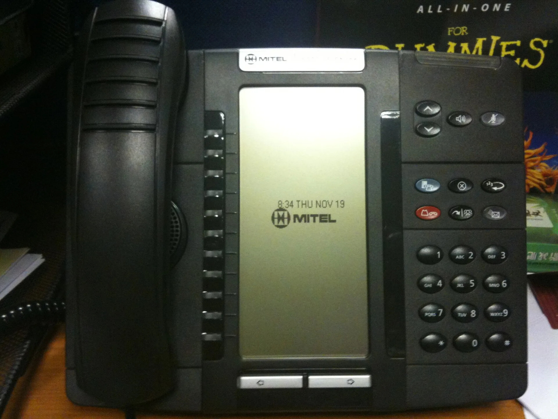 Mitel Model 5320 VoIP phone as seen on an office desk in London, England. E911 VoIP small business checklist: questions for the sales call