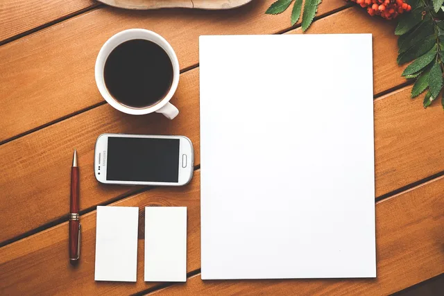 coffee, phone, paper, business, branding, blank, business card, template, smartphone, mobile, cellphone, pen, wooden table, desk, table, flat lay, copyspace, coffee, phone, paper, paper, business, business, business, business, business, branding, mobile, desk, table, table. Business mobile setup: device records and five-step returns